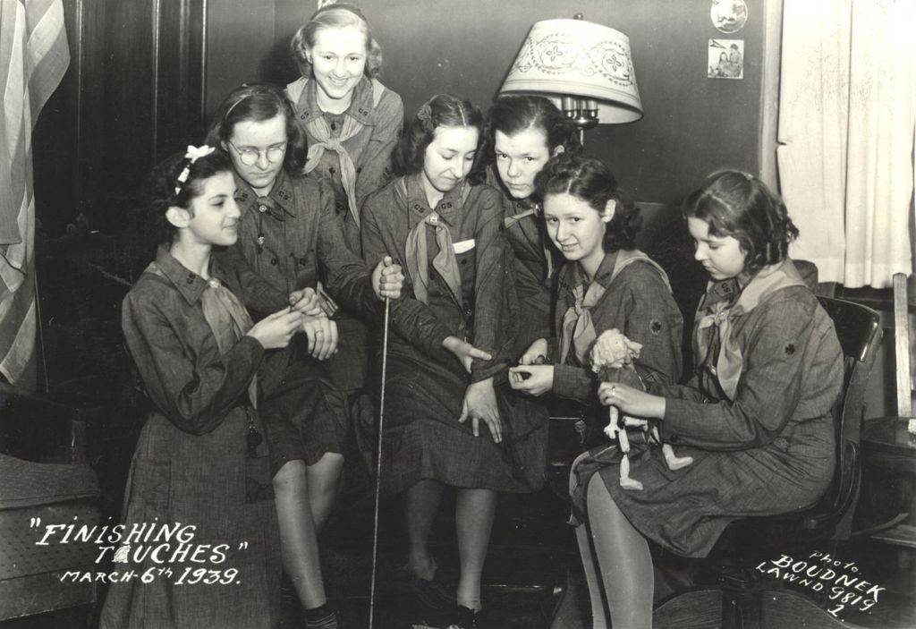 Group of Girl Scouts on couches and chair