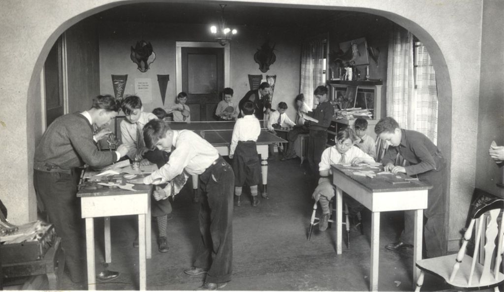 Children and adults playing games at the Marcy Community Club
