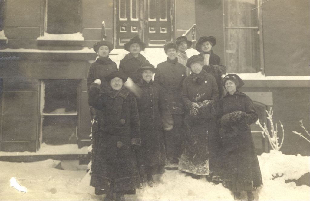 Women in front of building in the snow