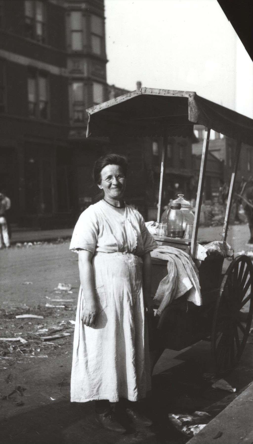 Woman with a vendor's cart on Maxwell Street