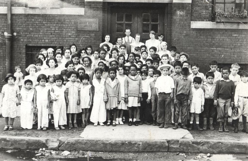 Large group of children outside Henry Booth House