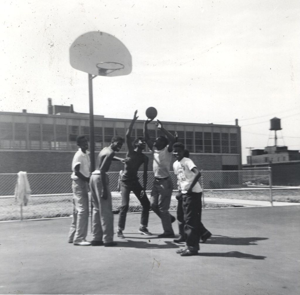Miniature of Teenagers playing basketball