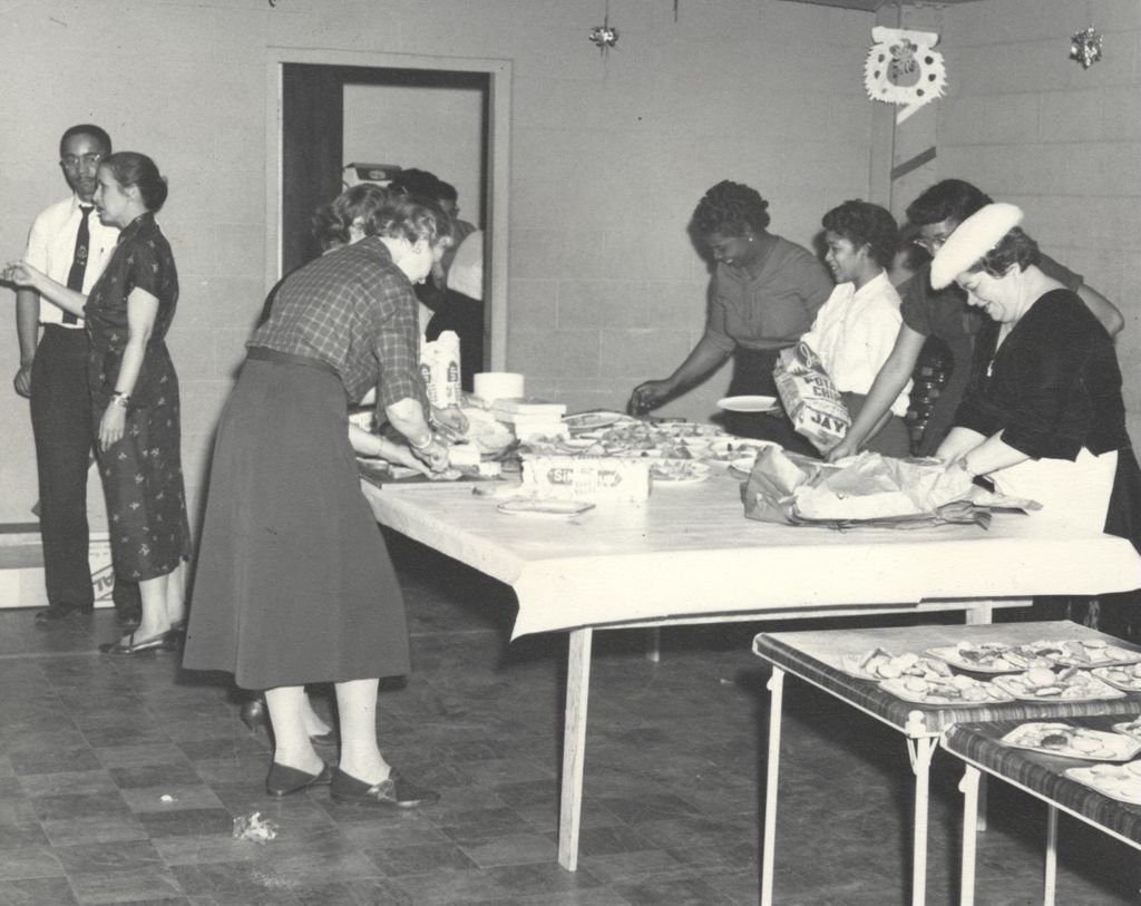 Women preparing plates of food