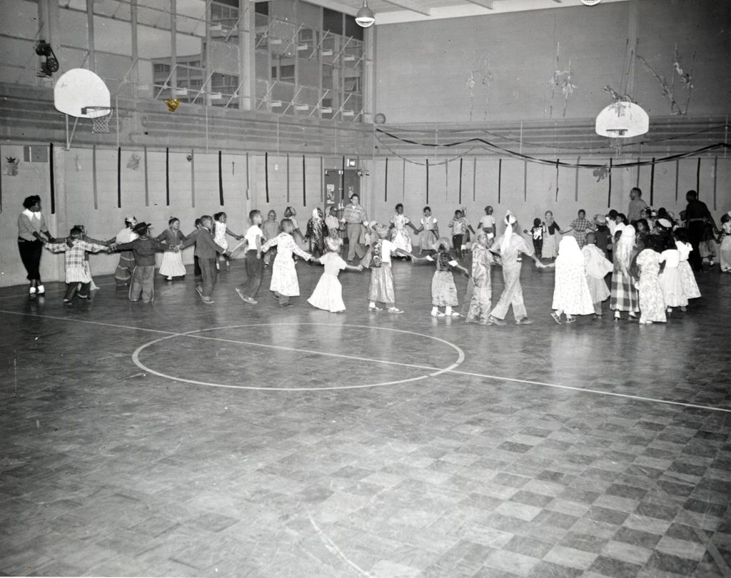 Children dancing in a gymnasium