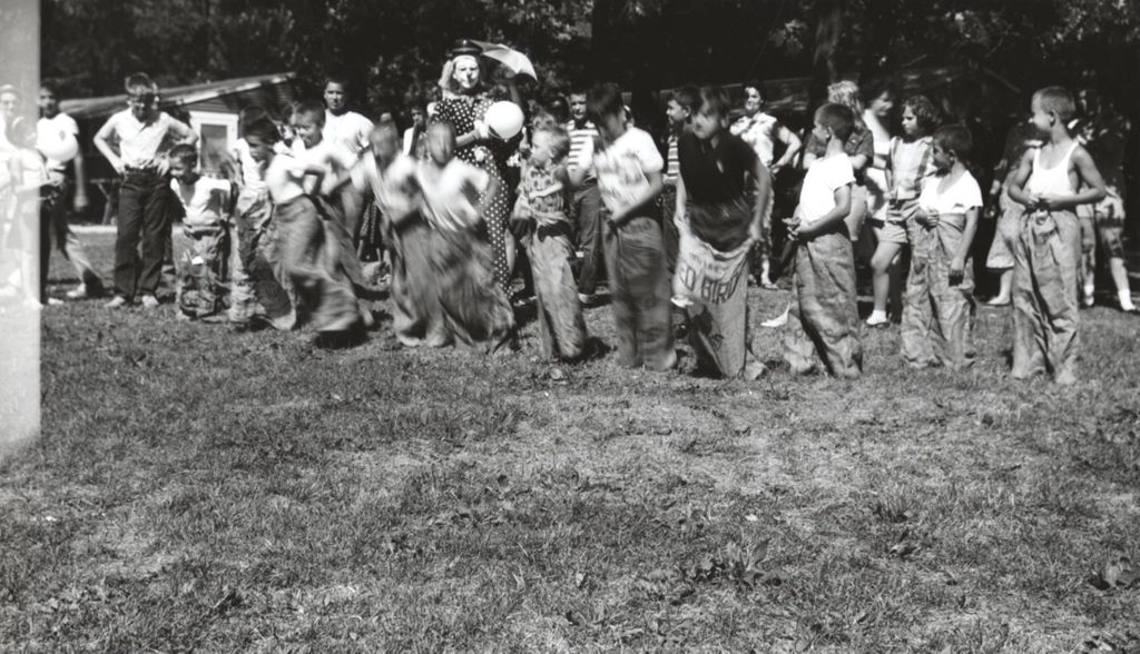 Sack race at Mother's Club Picnic for campers