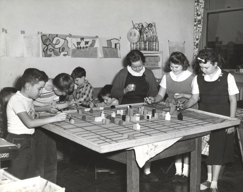 Miniature of Children painting a Community Model