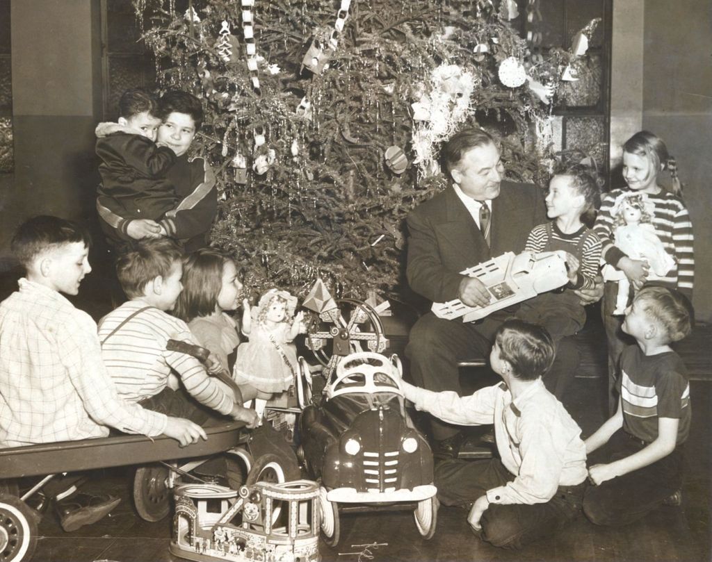 Children receiving presents from Colonel Mathieu