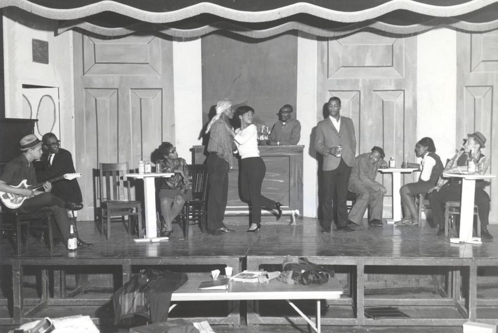 Teenagers and adults rehearsing a play