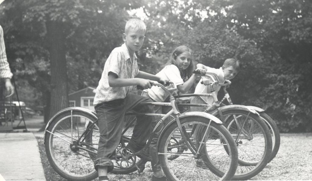 Children on bicycles at camp