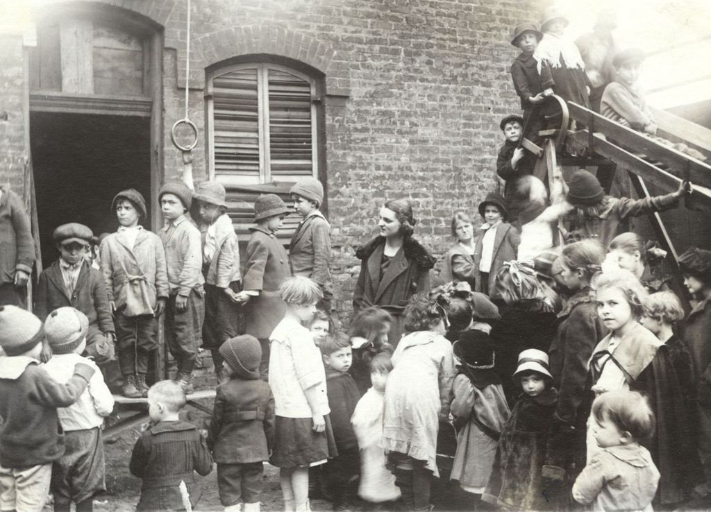 Children in playground behind Off-The-Street Club