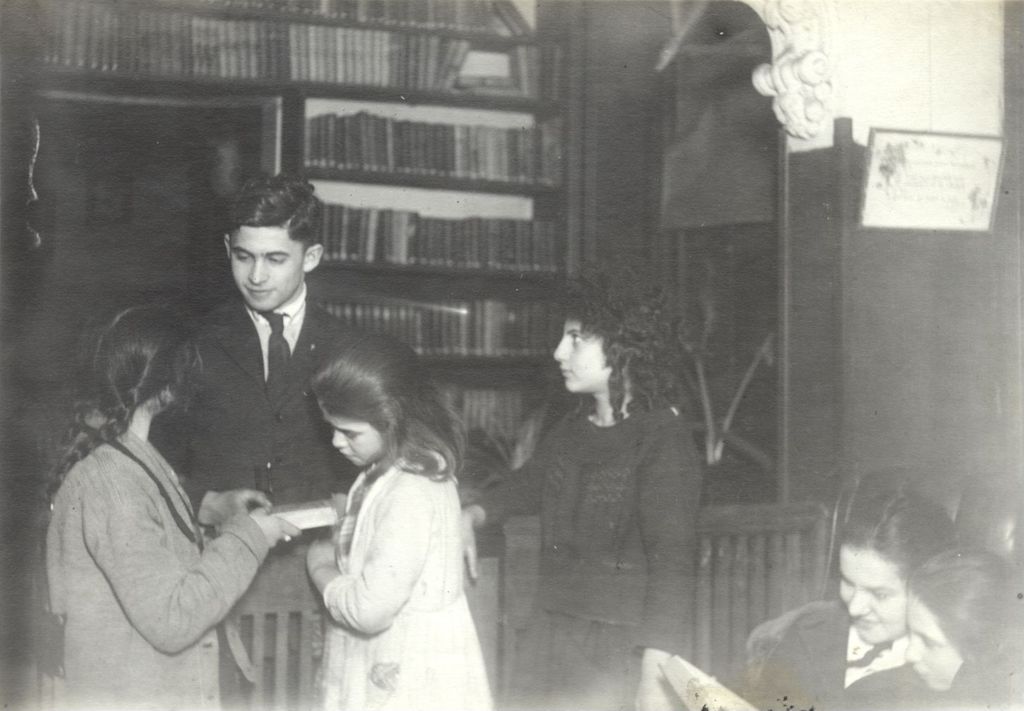 Miniature of Checking out books from Off-The-Street Club library