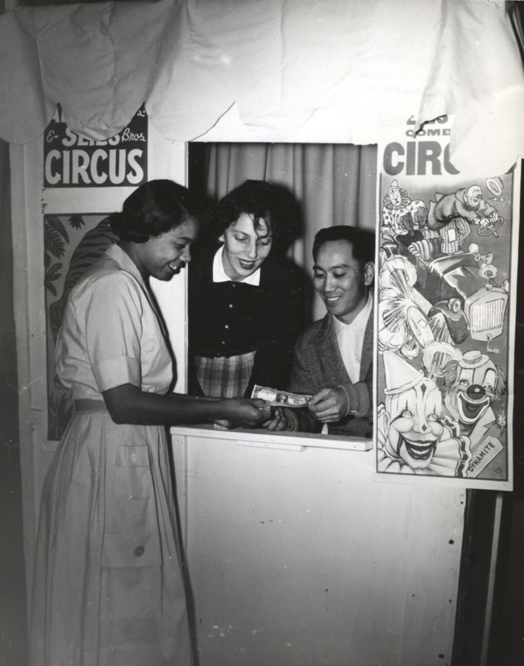 Woman and man selling circus tickets