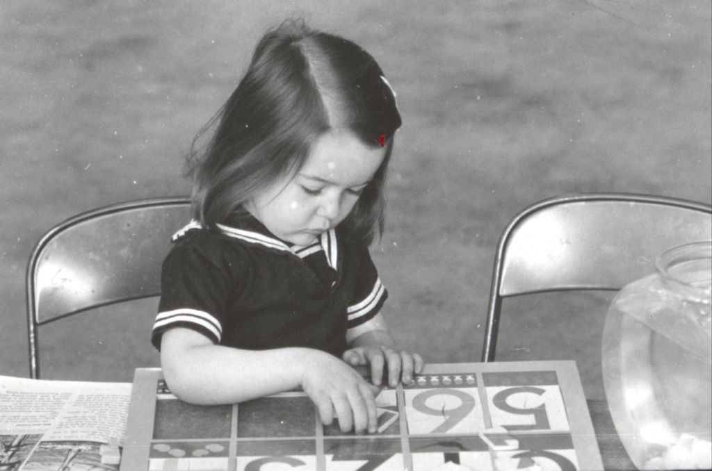 Miniature of Young girl playing number board game