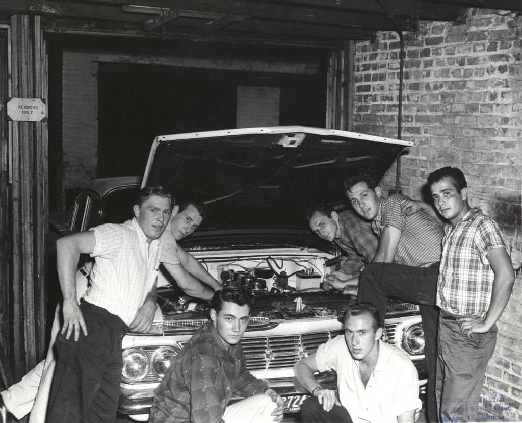 Miniature of Young men around a car with the hood open