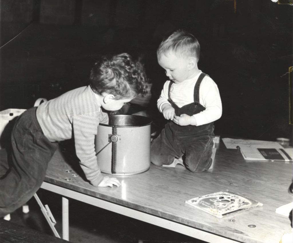 Children playing with a bucket