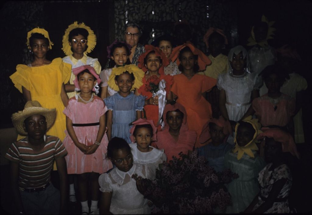 Teenagers and children wearing colorful costumes