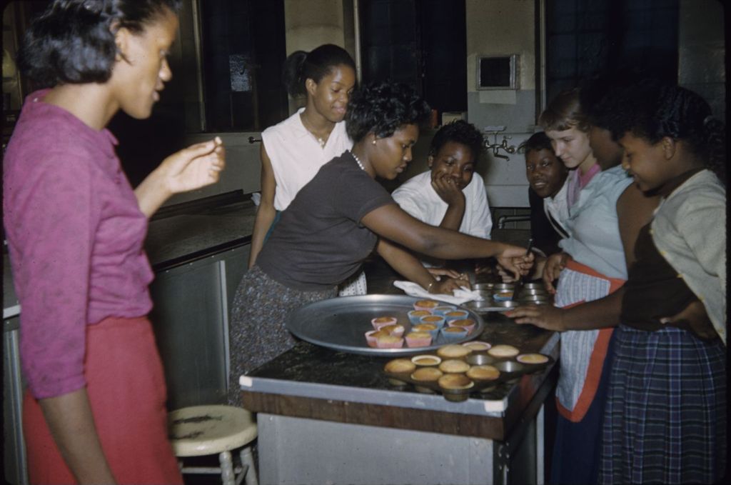 Girls and woman baking cupcakes
