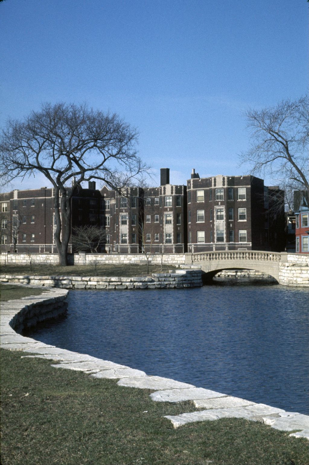 Auburn Park lagoon and apartment building