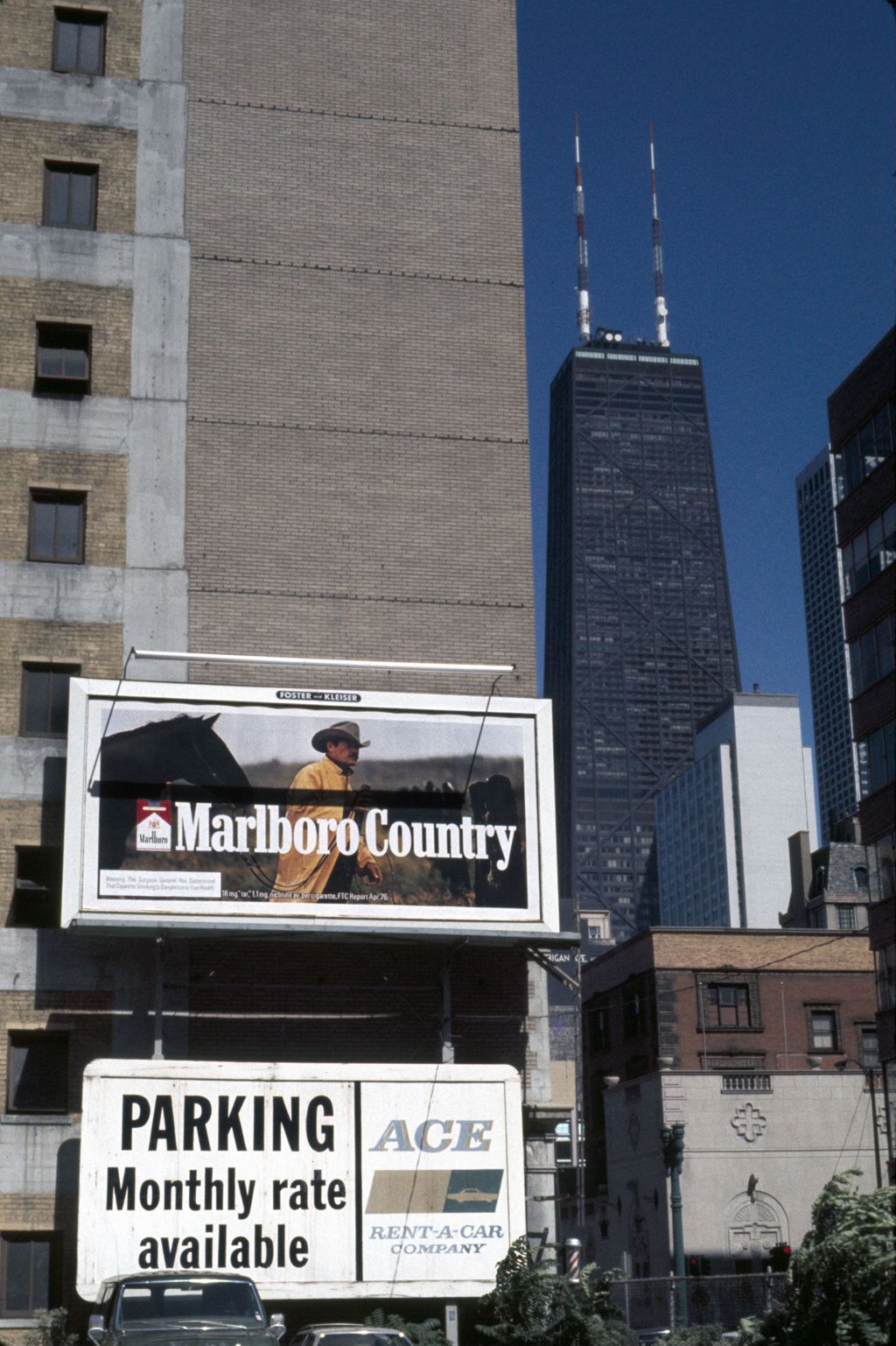Billboard advertisements for cigarettes and rental cars