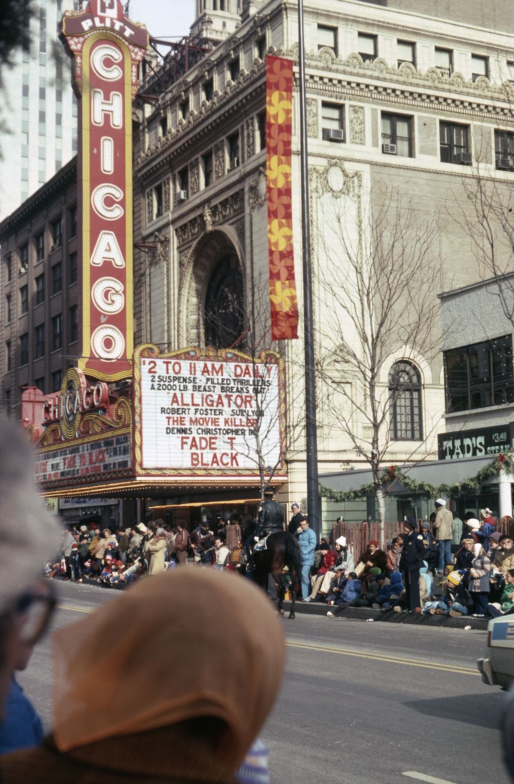 Thanksgiving Parade crowd in front of Chicago Theater