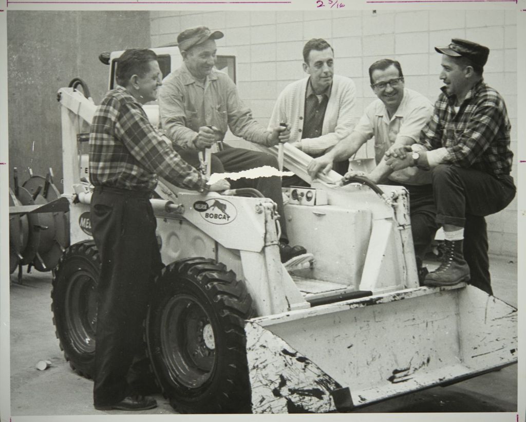 Miniature of Workers at the Physical Plant building using a snowplow