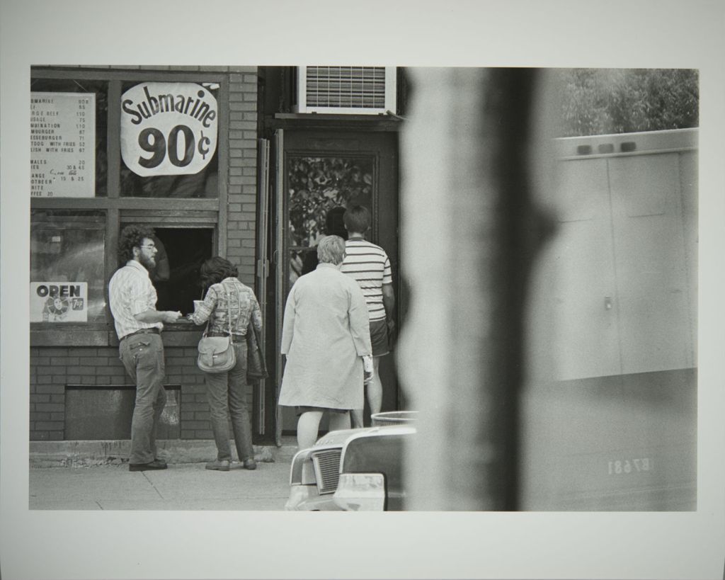 Students at a sandwich shop on Maxwell Street