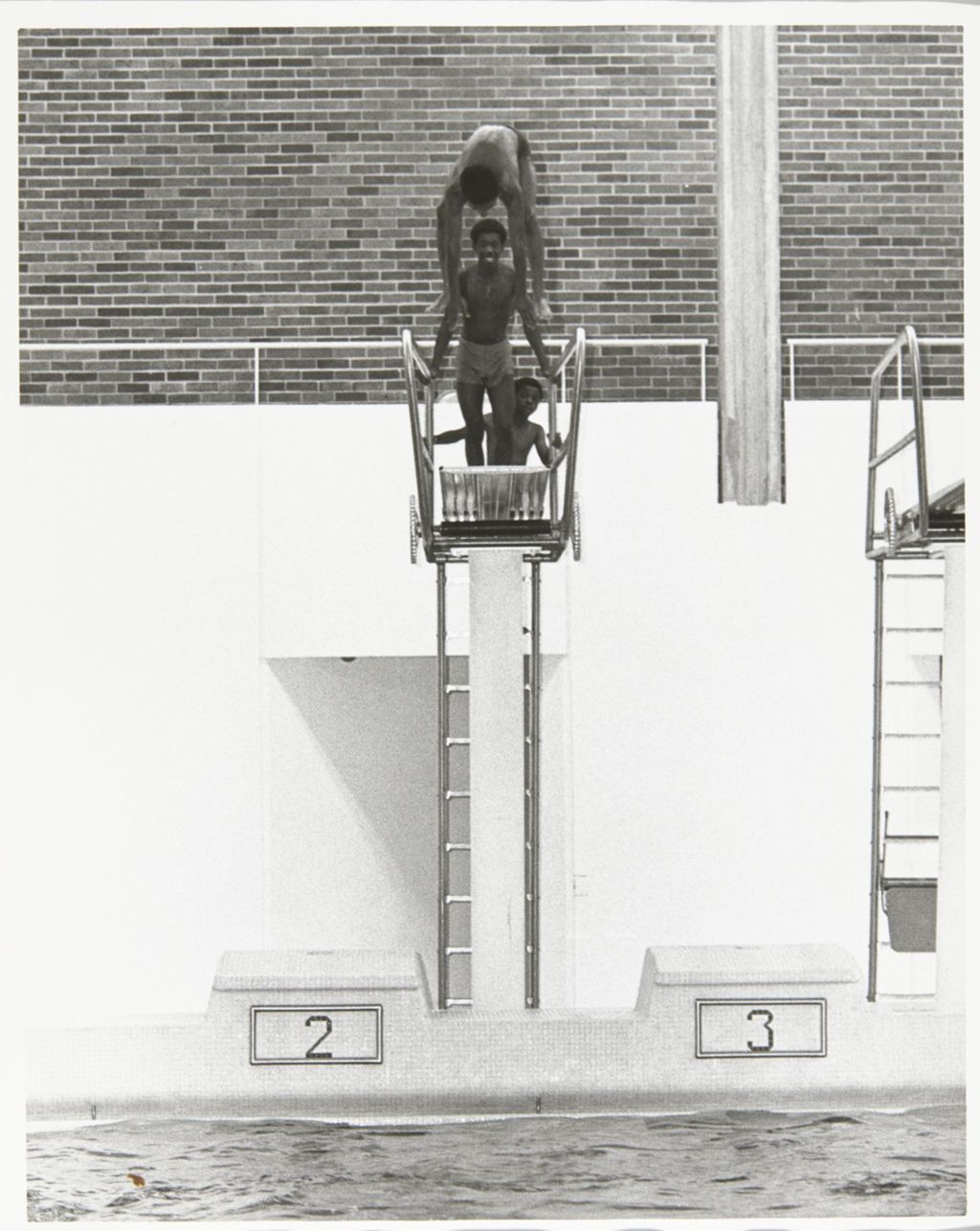People on the diving board during Mayor Richard J. Daley's Girls Summer Program