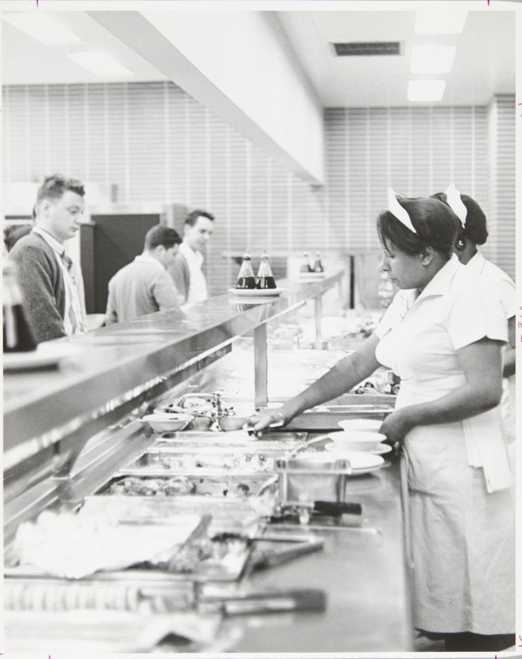 Miniature of Cafeteria workers serving lunch in the cafeteria at Student Center East