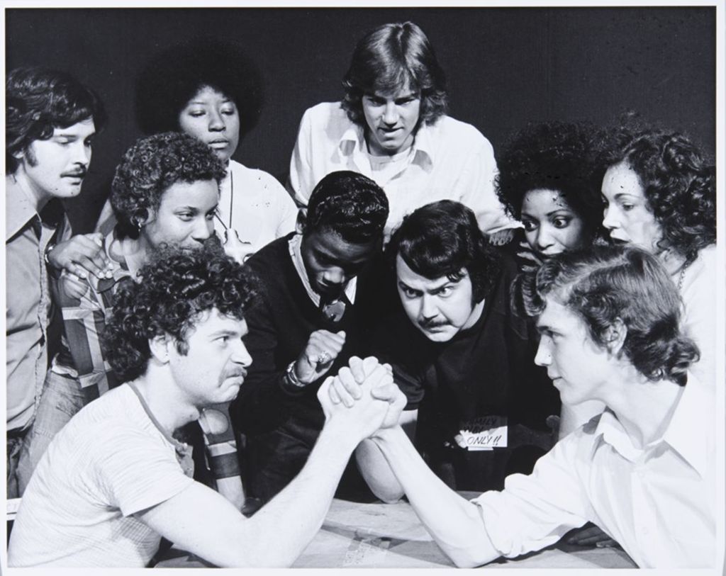 Miniature of Students watching two people arm wrestle