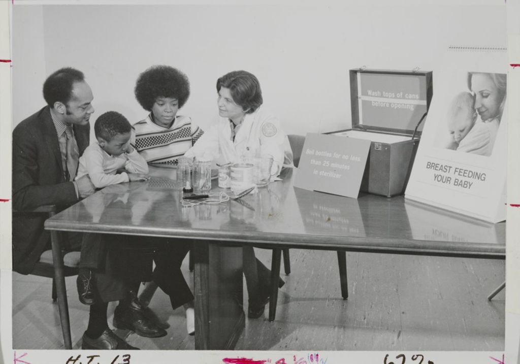 Miniature of Student teaching a family about dietetics in the School of Public Health