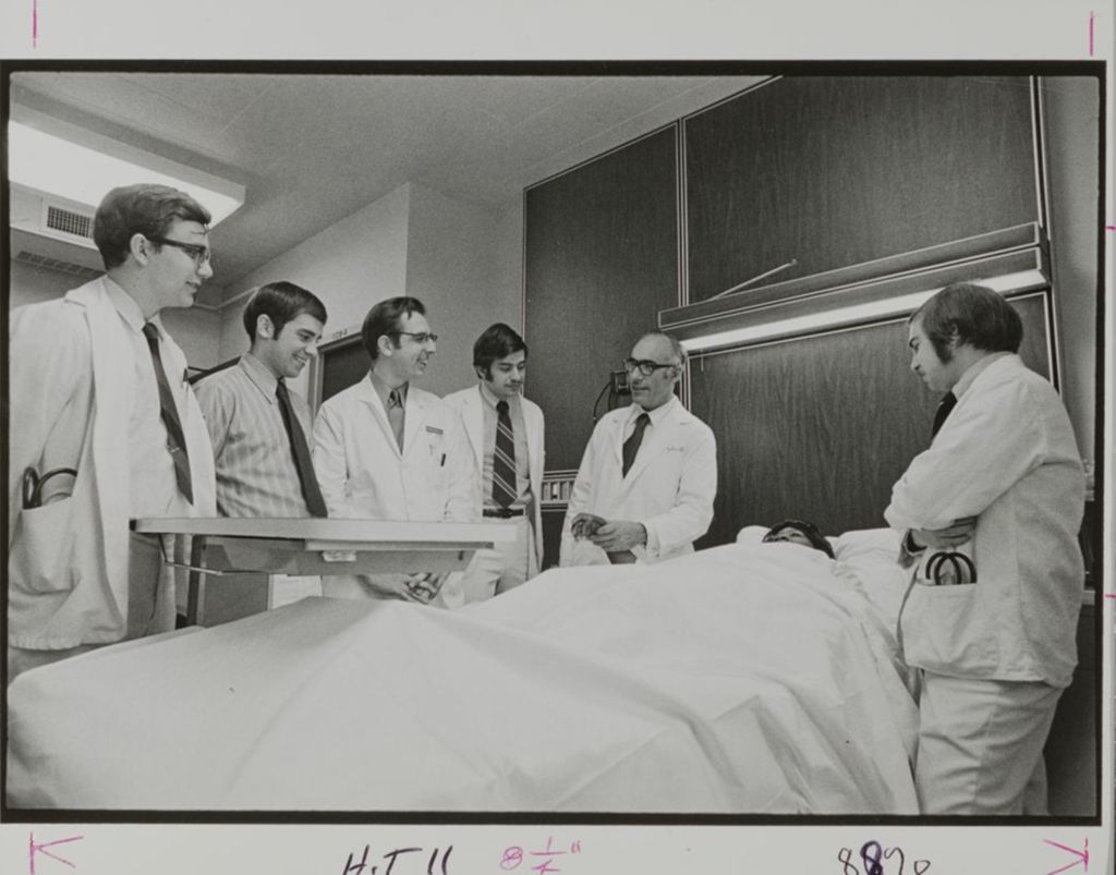 Miniature of Students and doctors checking in on a patient