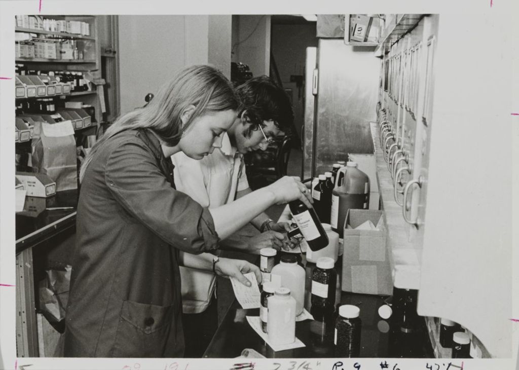 Miniature of College of Pharmacy students measuring pharmaceuticals