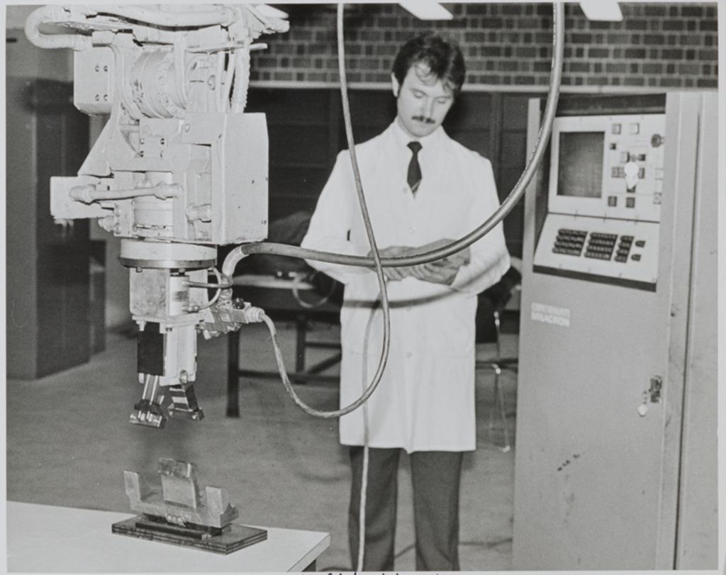 Person operating robotics in the Robotics Laboratory