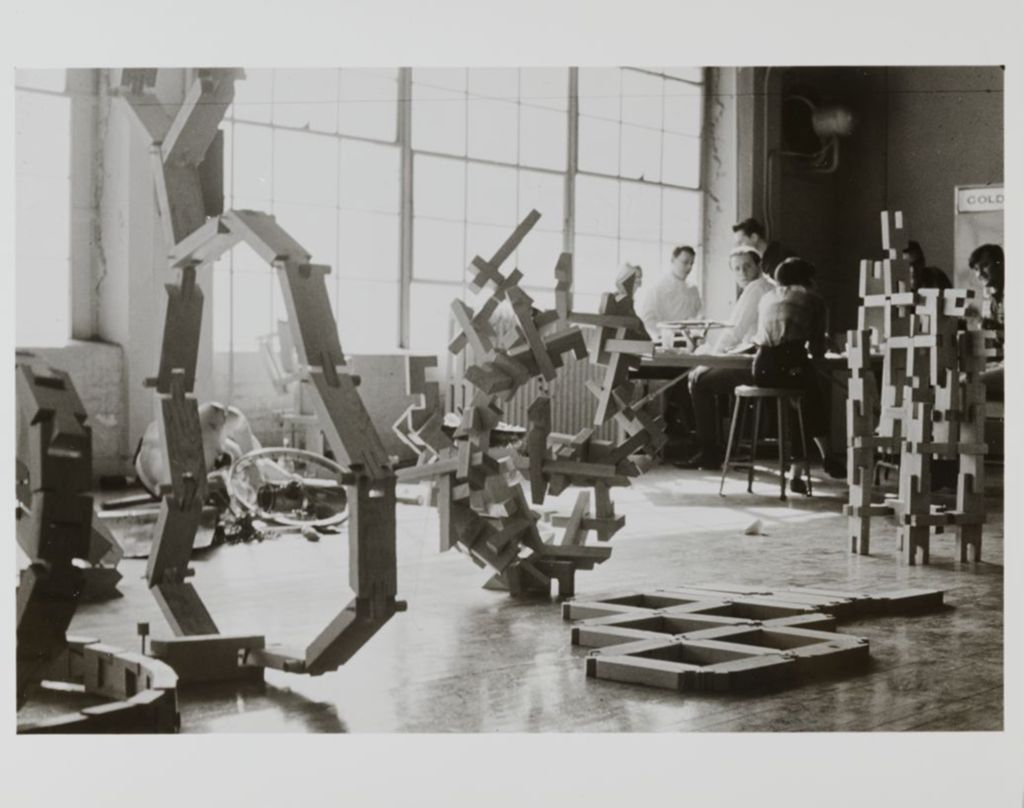Miniature of Students in a classroom with large models of designs