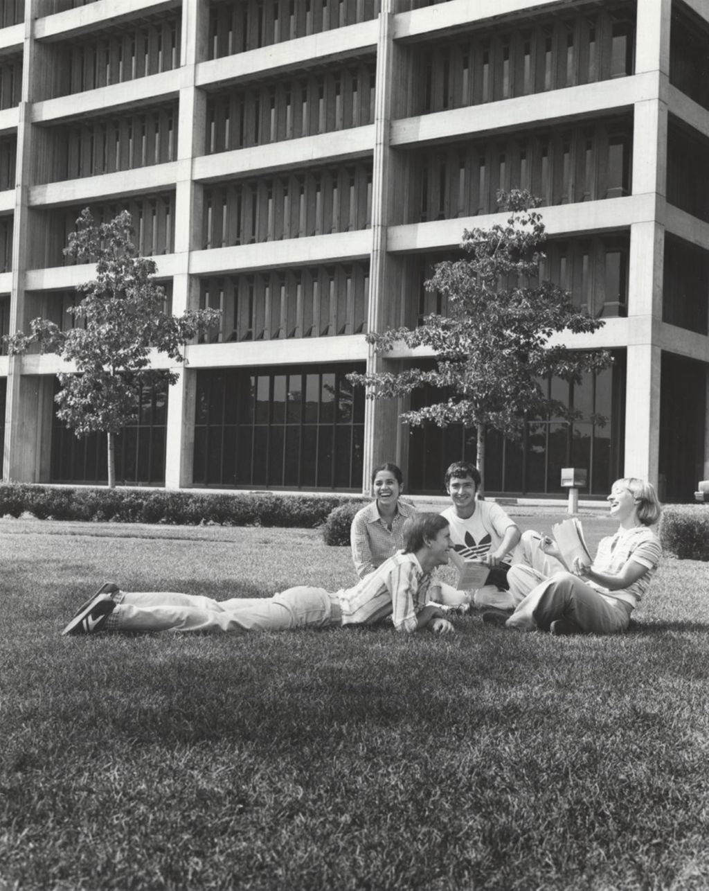 Miniature of Students sitting in front of the Science and Engineering Offices building