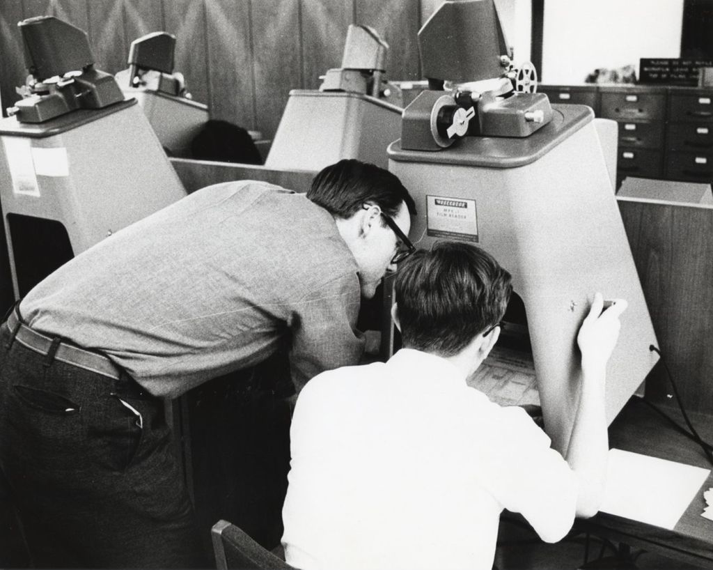 Student using a microfilm reader at the Richard J. Daley Library
