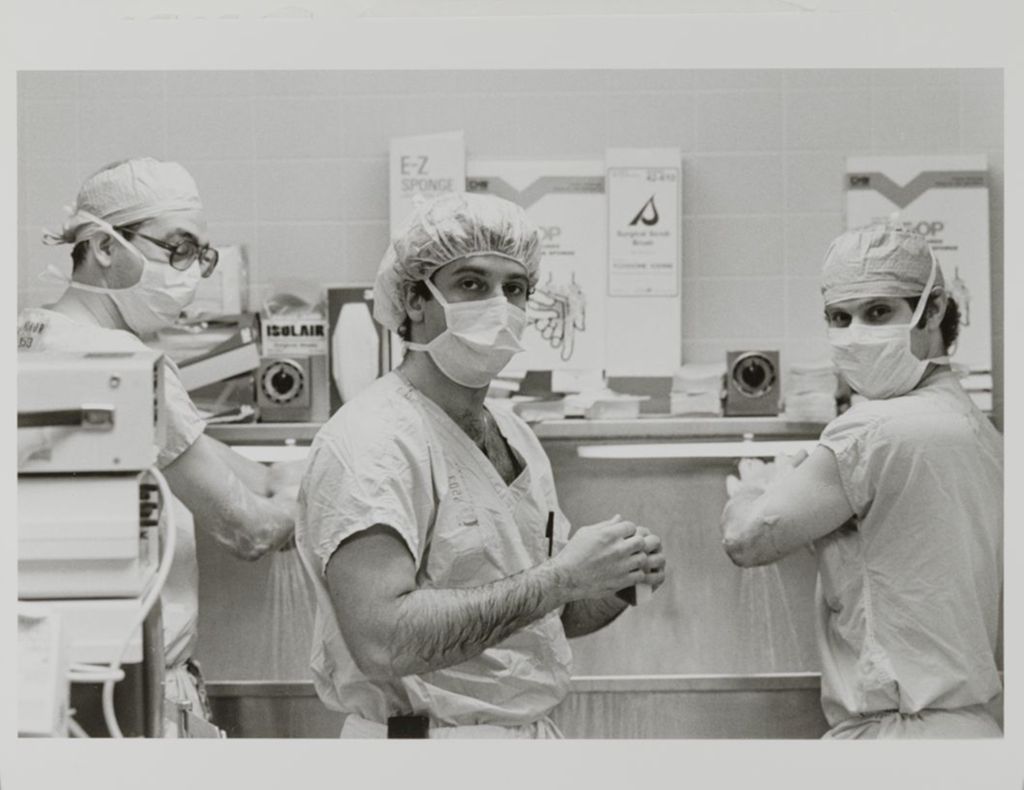 Miniature of Three people washing up for surgery