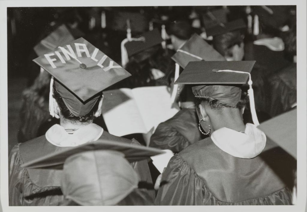 Student with a decorated mortarboard in line at the graduation ceremony