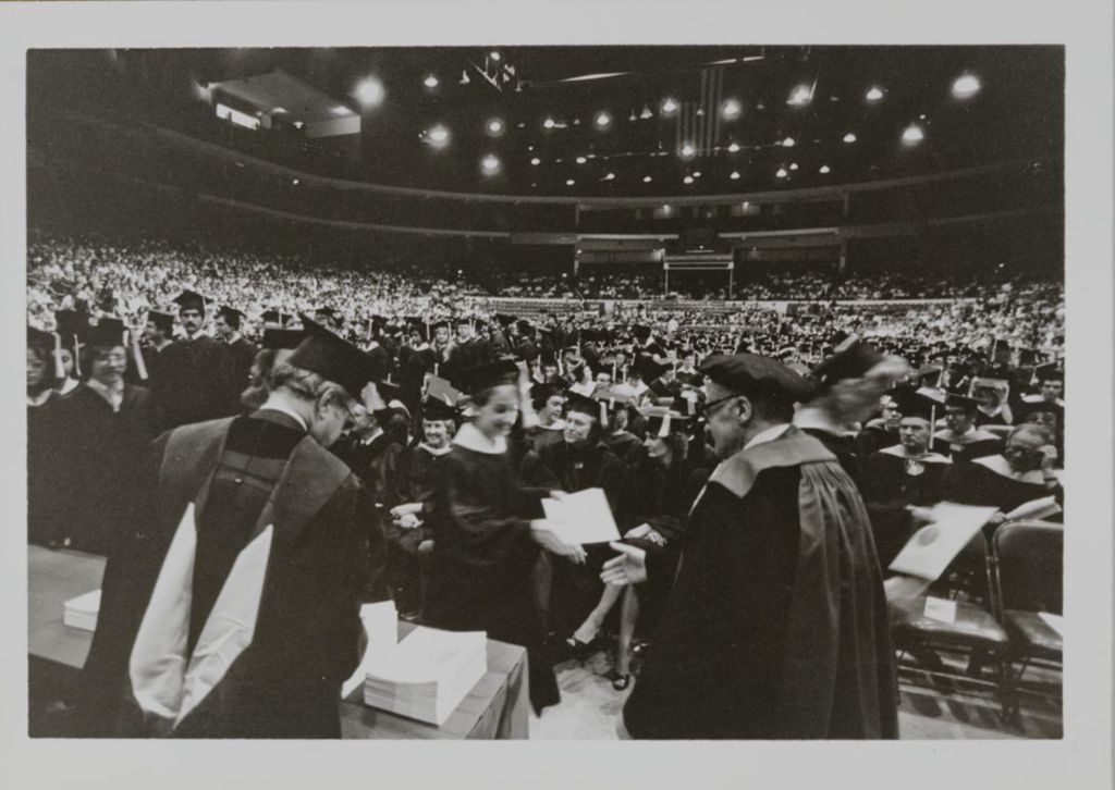 Miniature of Students receiving their diplomas at the graduation ceremony
