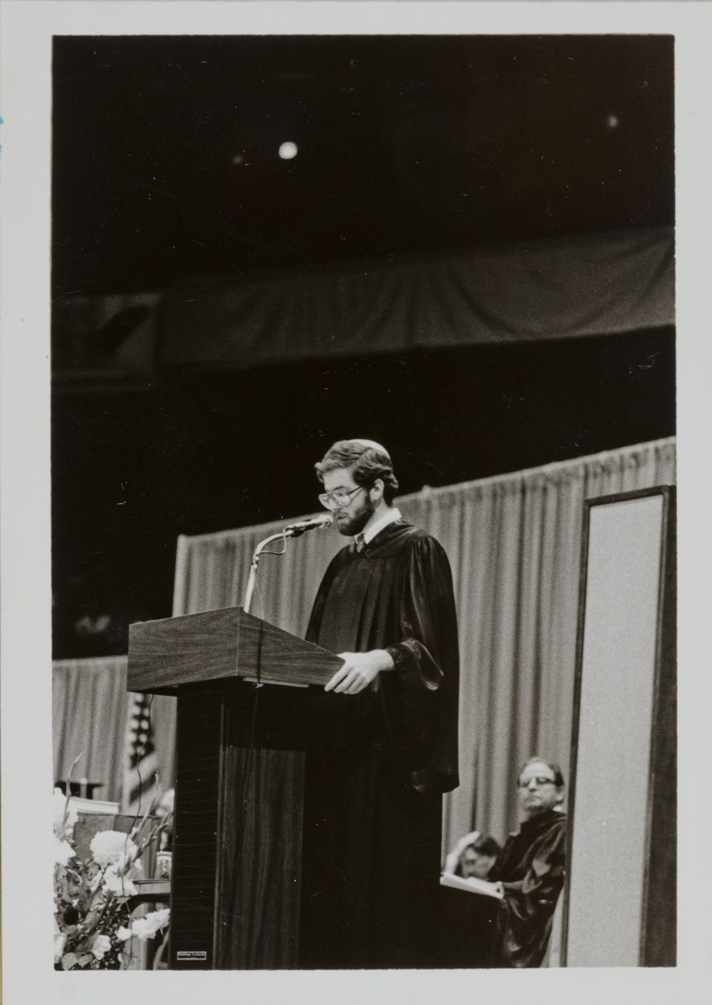 Miniature of Student Jeremy J. Newberger addressing the audience at the graduation ceremony