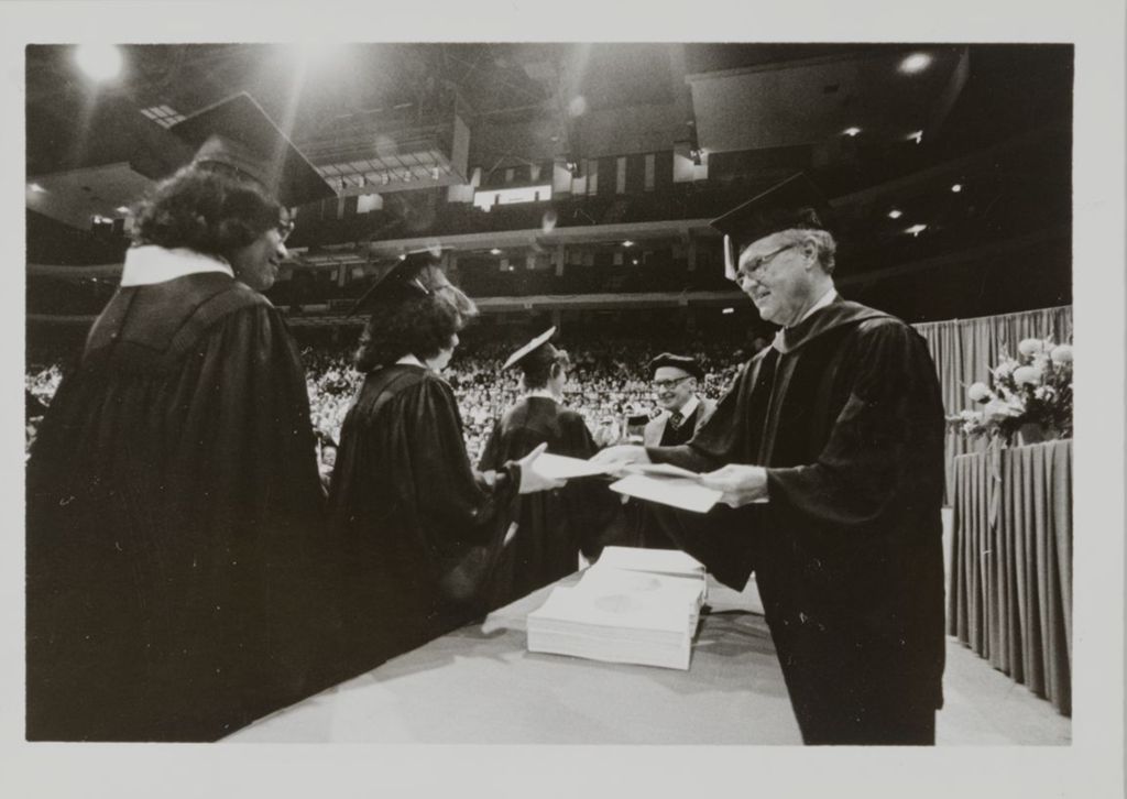 Associate Dean of the College of Liberal Arts and Sciences, Robert E. Corley, at graduation