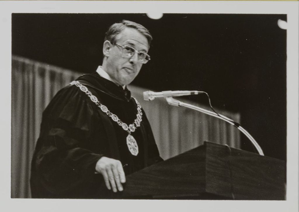 Miniature of University of Illinois President Stanley O. Ikenberry addressing the audience at graduation