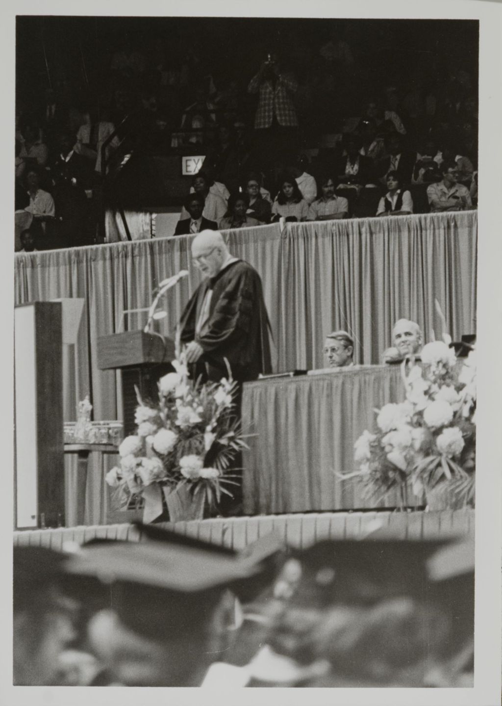 Chancellor Donald H. Riddle addressing the audience at the graduation ceremony