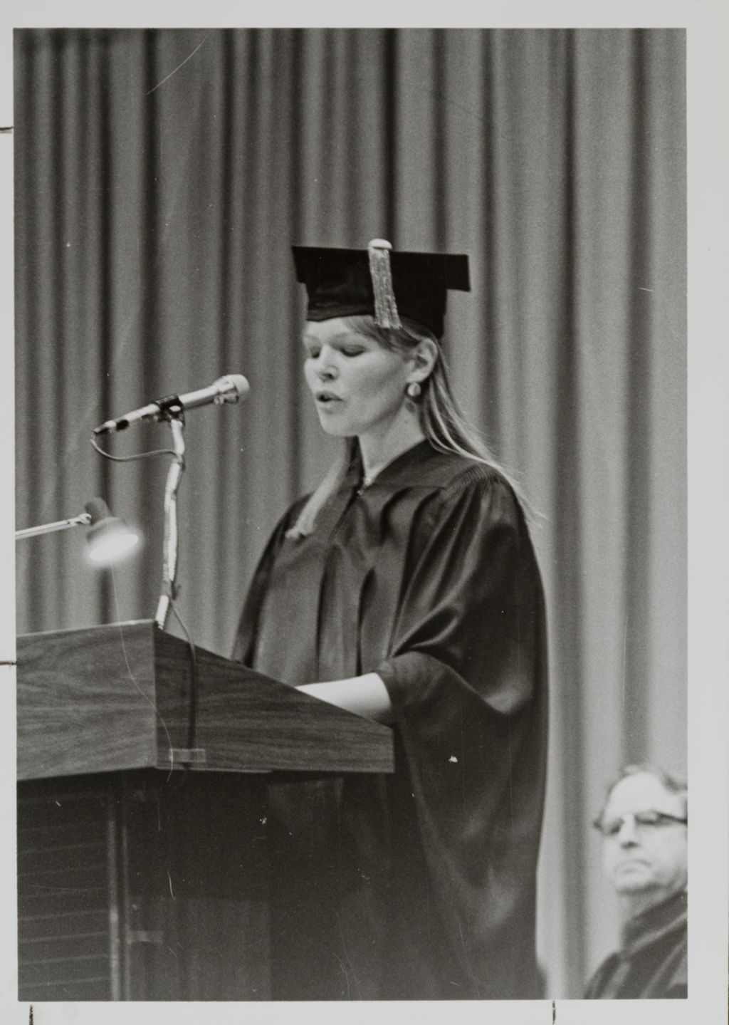 Unidentified person addressing the audience at the graduation ceremony