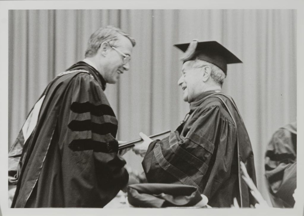 Miniature of University of Illinois President Stanley O. Ikenberry and unidentified honorary degree recipient at the graduation ceremony