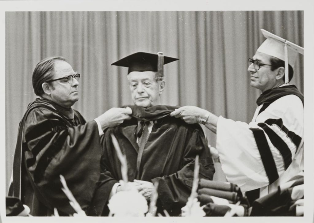 Miniature of Honorary degree recipient Abner Mikva (center) at the graduation ceremony