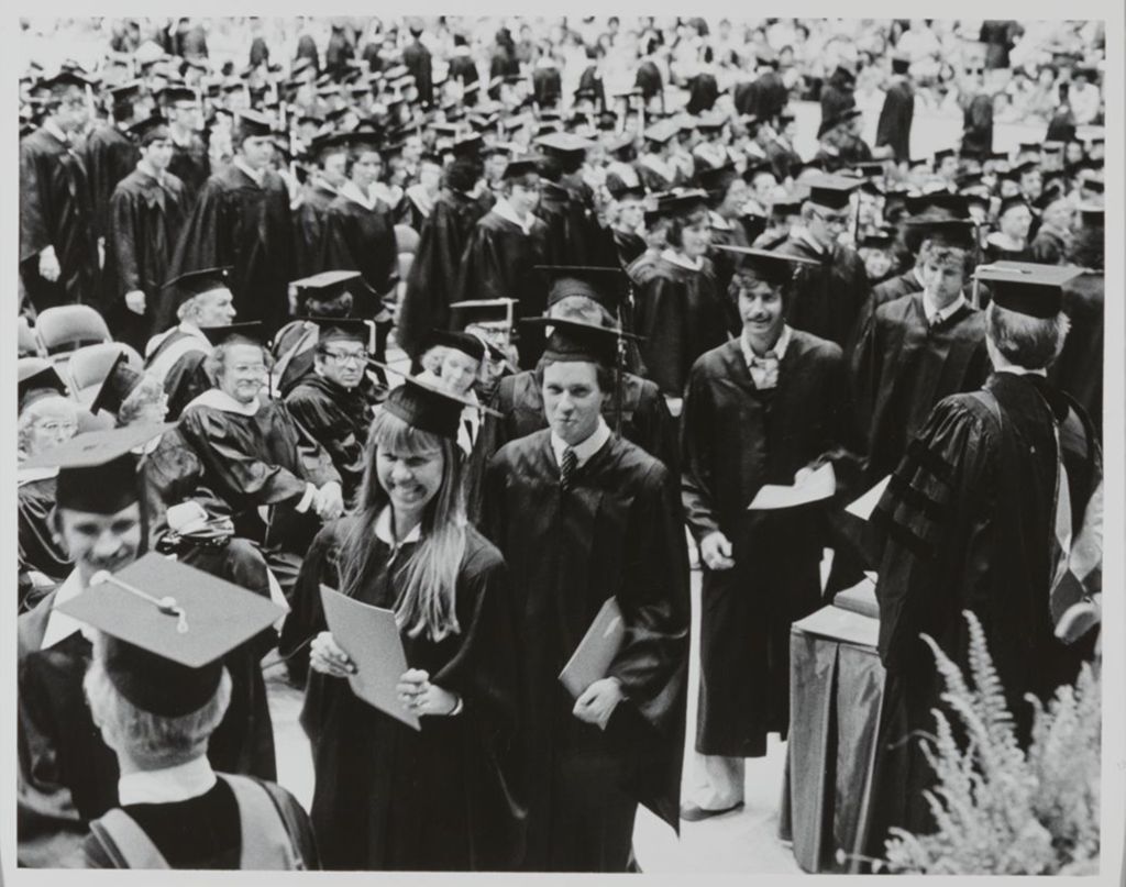Students receiving their diplomas at the graduation ceremony