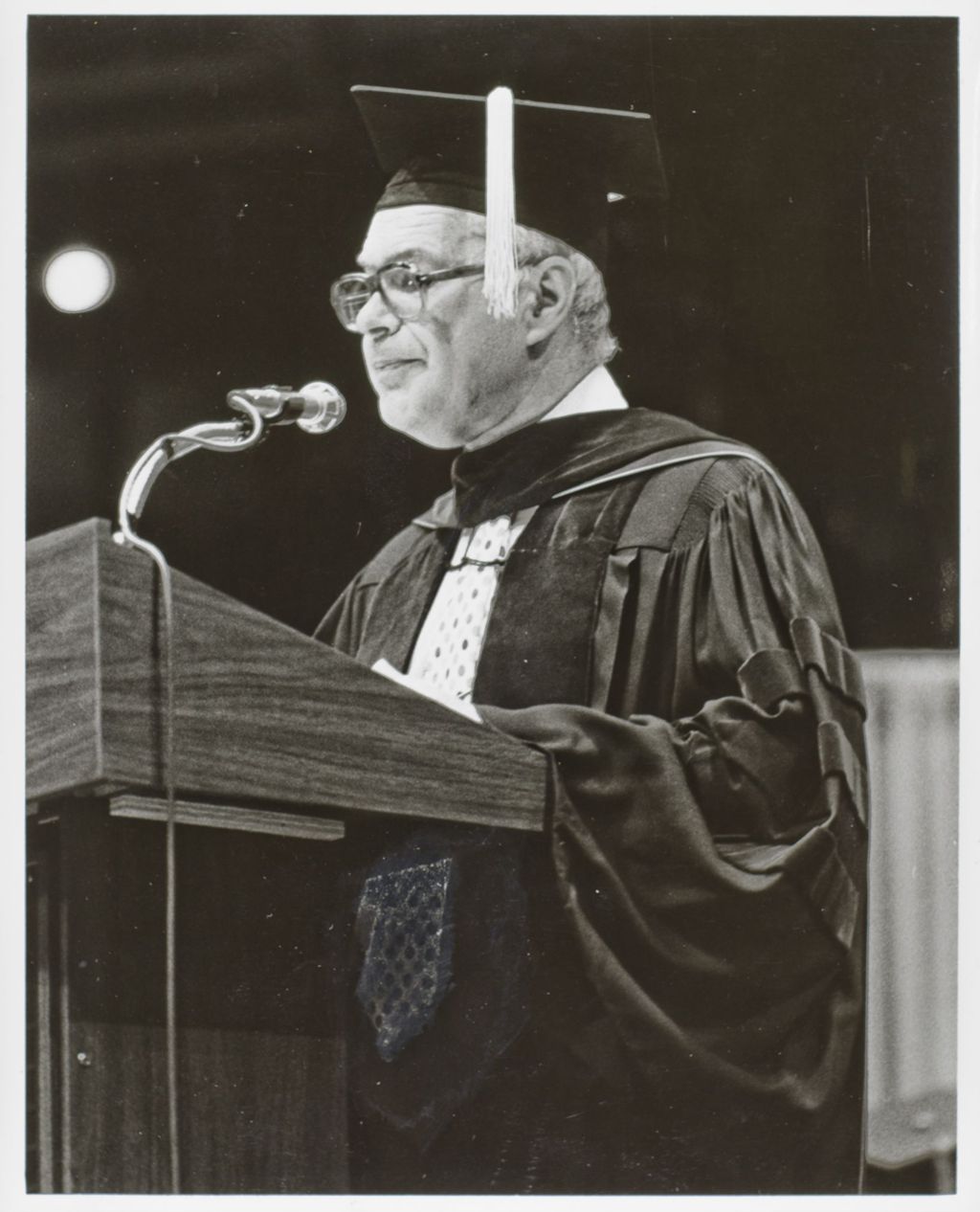 Miniature of Chancellor Donald Riddle addressing the crowd at the graduation ceremony