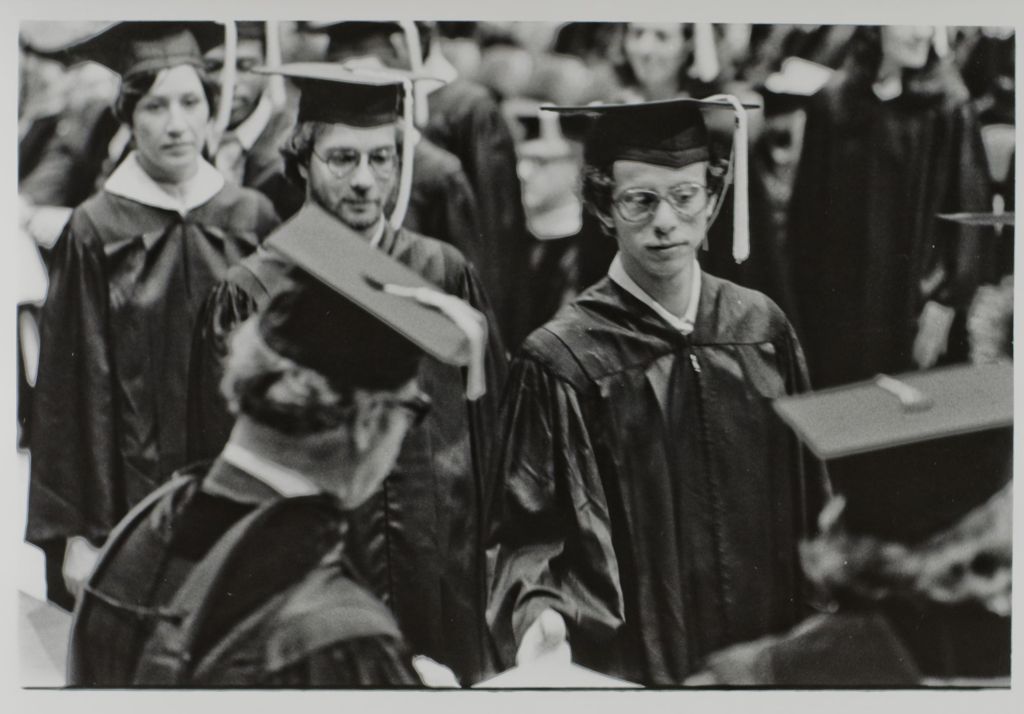 Students receiving their diplomas during the graduation ceremony