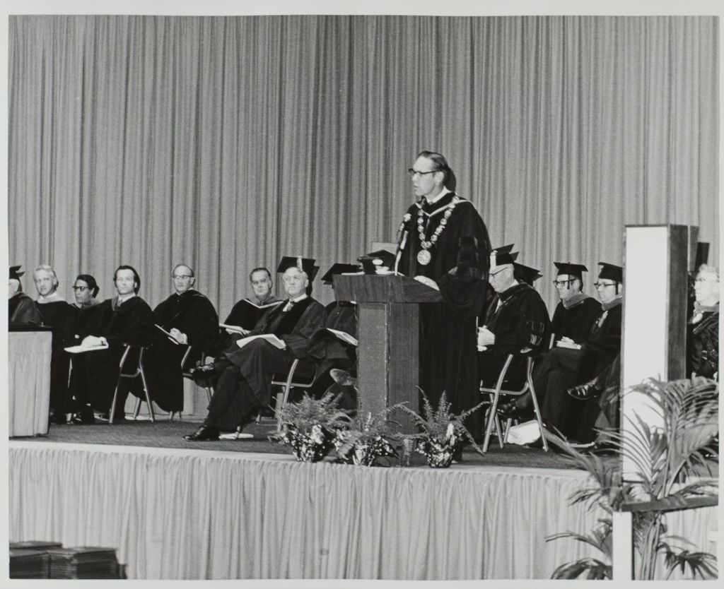 Miniature of University of Illinois President John E. Corbally at the graduation ceremony